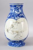 A GOOD JAPANESE MEIJI PERIOD BLUE & WHITE PORCELAIN RELIEF VASE - decorated in blue with phoenix