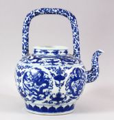 A LARGE CHINESE BLUE AND WHITE TEA POT, painted with roundels of dragons amongst symbols and