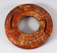 A CHINESE CARVED JADE DOUBLE RING - carved in archaic style - 11.5cm