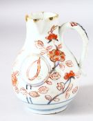 A JAPANESE ARITA PORCELAIN OIL JUG / EWER, painted with flowers, 12cm high.