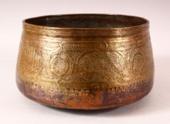 A 16TH CENTURY MAMLUK COPPER BOWL, with engraved decoration and calligraphy, 27cm diameter.
