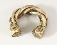 A SEJLUK WHITE METAL TWISTED BANGLE, The lower with a hall mark OR makers mark. 8cm