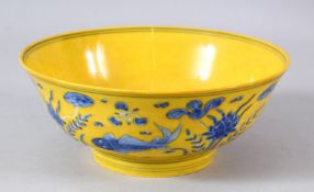A CHINESE YELLOW GROUND PORCELAIN FISH BOWL - decorated with a yellow ground and scenes of fish