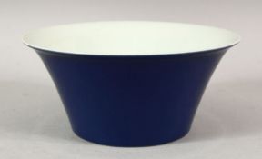 A GOOD CHINESE BLUE GLAZED BOWL with white interior, six character mark in blue, 15cm diameter.