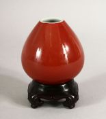 A KANGXI SONG DE BOEUF PEACH VASE and stand, six character mark in blue, 7cm high.