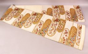 A FINE QUALITY JAPANESE EMBROIDERED SILK FUKURO OBI TIE, with a beige ground and floral and gilt