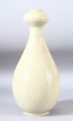 A CHINESE DING STYLE VASE, with carved sgraffito floral sprays to the body, 33cm high.