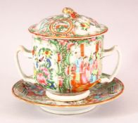 A CHINESE CANTON TWIN HANDLE ECUELLE, COVER AND SAUCER, painted with panels of figures, birds and