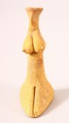 A SMALL AFGHAN TERRACOTTA FIGURE, stylised figure of female form, 9cm high.