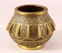 A 19TH CENTURY PERSIAN QAJAR ENGRAVED BRONZE MORTAR - with multi head decoration 12cm