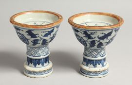 A PAIR OF CHINESE BLUE AND WHITE CIRCULAR CANDLESTICKS 4ins high