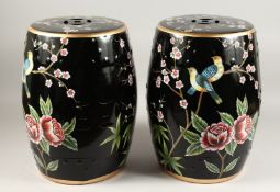 A PAIR OF CHINESE FAMILLE NOIR BARREL SEATS with birds 18ins high.