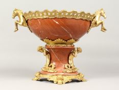 A GOOD PAIR OF RED MARBLE URNS, TWO HANDLE CENTREPIECE with ormolu cherub supports. 12ins high.