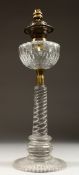 A GOOD VICTORIAN GLASS OIL LAMP on a circular base. 23ins high