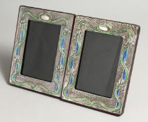 A PAIR OF SILVER ART NOUVEAU DESIGN PHOTOGRAPH FRAMES 7.5 X 5ins