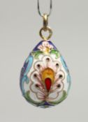 A SMALL RUSSIAN SILVER AND ENAMEL EGG PENDANT