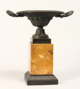 A REGENCY BRONZE TWO HANDLED CIRCULAR TAZZA on a marble plinth 9ins high.