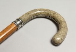 A WALKING STICK with shagreen silver handle. 32ins long, LONDON 1909, Jermyn Street, London.