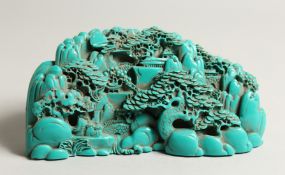 A CHINESE CARVED TURQUOISE BOULDER 9.5ins long.