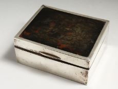 A SILVER AND TORTOISESHELL CIGARETTE BOX with match case and ashtray. 1927.