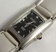 A GUCCI WRIST WATCH BOXED.