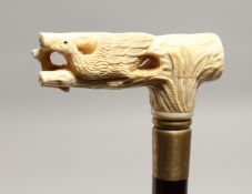 A WALKING STICK with bone EAGLE handle 36ins long.