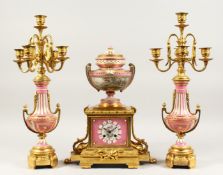 A VERY GOOD 19TH CENTURY FRENCH ORMOLU AND PORCELAIN THREE PIECE CLOCK GARNITURE, the clock with