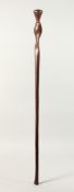 A PLAIN SOLOMAN ISLAND WOODEN STICK with twist top 37ins long.