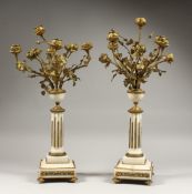 A GOOD PAIR OF LATE 19TH CENTURY MARBLE AND ORMOLU FIVE LIGHT CANDELABRA. modelled as an urn of