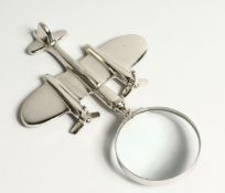 A NOVELTY MAGNIFYING GLASS the handle as a plane.