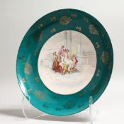 A CONTINENTAL PORCELAIN DISH, the centre decorated with classical female figure and attendants, in a