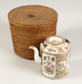 A CANTON TEA POT in a basket
