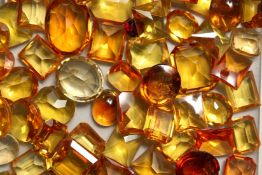 A BOX OF TOPAZ AND CITRINE STONES.