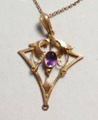 A GOLD PENDANT AND CHAIN.