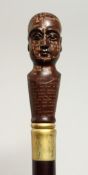 A NOVELTY WALKING STICK with PHRENOLOGY HEAD handle 36ins long