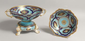 A NORITAKE PORCELAIN TWIN HANDLED PEDESTAL BOWL, pale blue ground with rich blue floral decorated