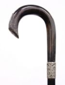 A SILVER MOUNTED WALKING STICK.