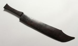 A CARVED WOOD MODEL OF A KNIFE 19.5 ins long