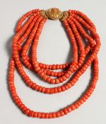A SUPERB FIVE ROW CORAL NECKLACE with a gold claps.