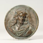 A SMALL BRONZE CLASSICAL PLAQUE OF CHRIST. 3.5ins diameter.