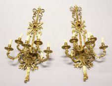 A SUPERB LARGE PAIR OF BRONZE WALL SCONCES each with three scrolling branches 46ins long.