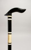 A BLACK AND WHITE WALKING STICK 36ins long.