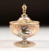 A GOOD GLASS CIRCULAR BOWL AND COVER with gilt decoration and white enamel painted with birds. 3.