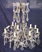 A good large wrought iron and cut glass Venetian style chandelier. A GOOD LARGE WROUGHT IRON AND CUT