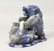 A GOOD CARVED STONE BEAR GROUP. 6.5ins high.