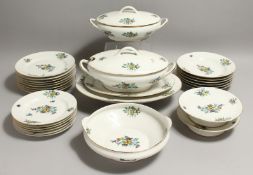 A LIMOGES PORCELAIN PART DINNER SERVICE,decorated with stylised flowers, comprising eight dinner