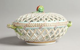 A 19TH CENTURY DRESDEN LATTICE OVAL BASKET AND COVER with fruit and rustic border. 11ins long