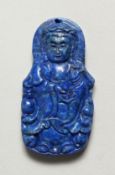 A CARVED LAPIS PENDANT. 2ins long.