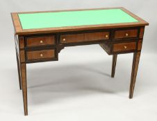 A MAHOGANY AND INLAID WRITING DESK with green leathercloth writing surface over an arrangement of