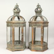 A PAIR OF SILVERED METAL AND GLASS HEXAGONAL LANTERNS 24ins high.